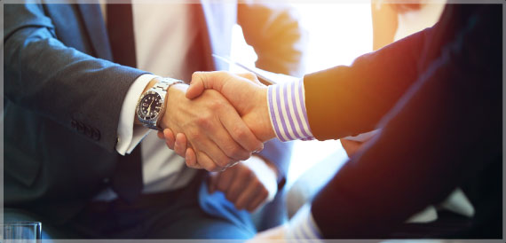 Business men shake hands.